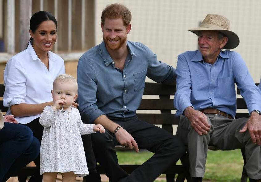 CUTE: The Duke and Duchess of Sussex, sitting next to Richard Woodley, appear besotted by his great granddaughter Ruby Carroll. Photo: DEAN LEWIS