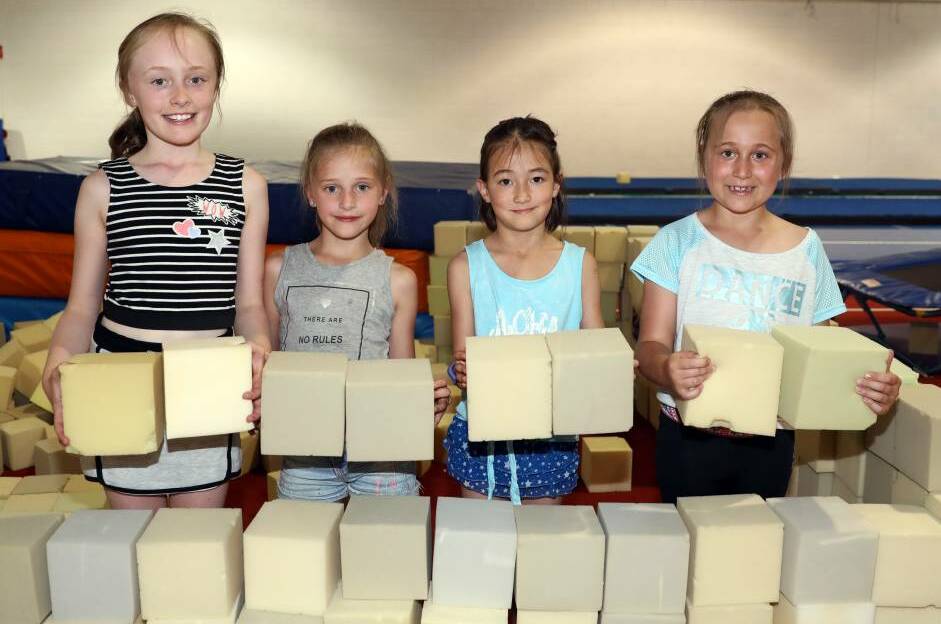 BUILDING MEMORIES: Ruby Kind, Evelyn Rose, Sora Burrell and Emma Jurd using foam blocks to make a fort at PCYC Orange during the school holidays earlier this year. Photo: ANDREW MURRAY