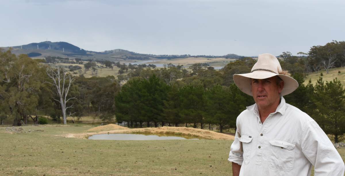 GOING NOWHERE: Dub Price stands at the back of his home on Weemala. In the far distance is Carcoar Dam.