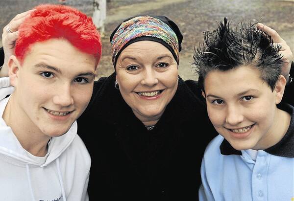 OUR CANCER CHAMPION: Sandy Ostini, pictured with her sons Kyle and Bryce in 2011, will leave a lasting legacy, according to Orange mayor Reg Kidd.