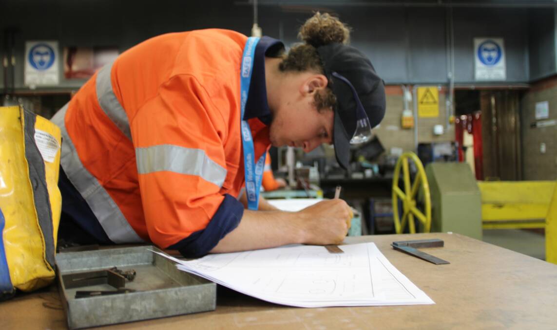 TAKING ON THE BEST: Steel student Harrison Gersbach finalising his plans. Photo: CONTRIBUTED