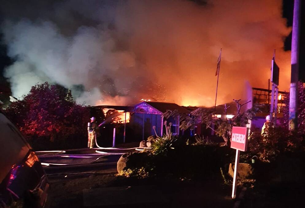 ON THE SCENE: NSW Fire and Rescue firefighters battling to control the blaze in the early hours of Saturday morning. Photo: FACEBOOK