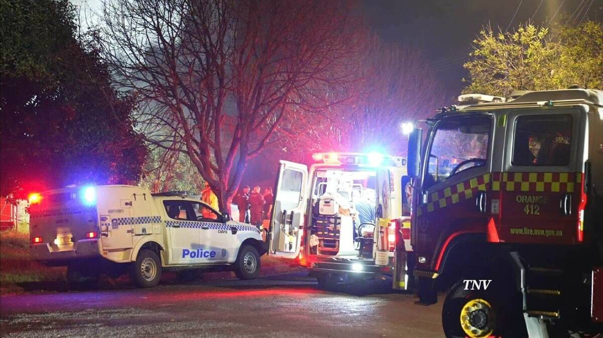 A picture of police, ambulance and fire trucks at Friday night's fatal house fire. Picture by Troy Pearson/TNV.