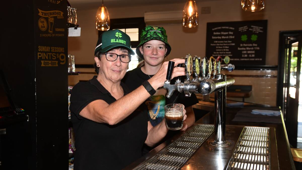 Kerrie Evans and Jessie Tudor pour a Guiness for St Patricks Day. Picture by Carla Freedman