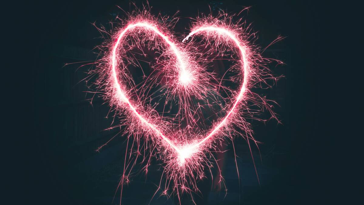 A love heart out of pink fireworks. Picture by Jamie Street on Unsplash