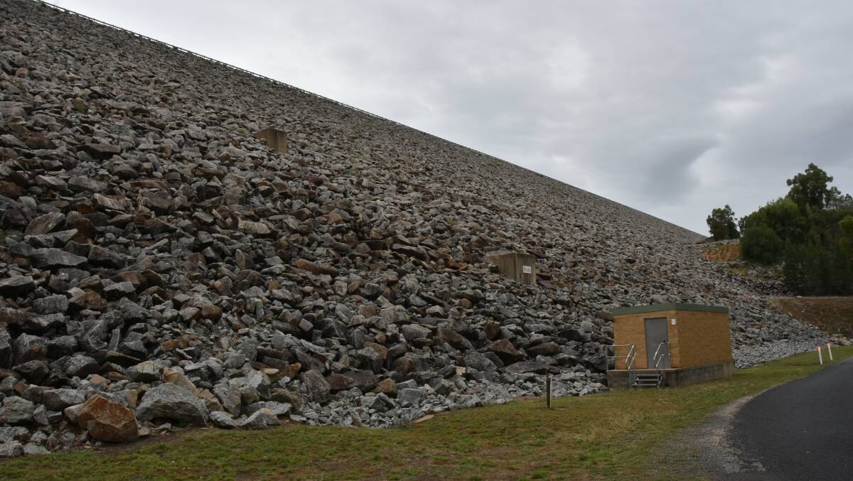 The current Wyangala Dam wall dwarfs utility buildings at its base. An engineer's report lodged with the government on Monday suggests raising the wall it will increase it's bulk by 40 per cent.