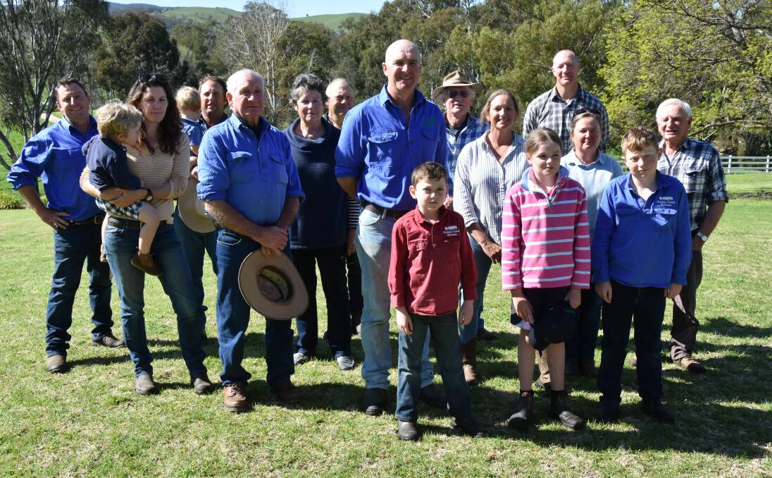 Some of the Reids Flat landholders who will be affected by the proposal to raise the Wyangala Dam Wall gathered this week to air their concerns. In a recent downpour water lapped the white fence in the background.