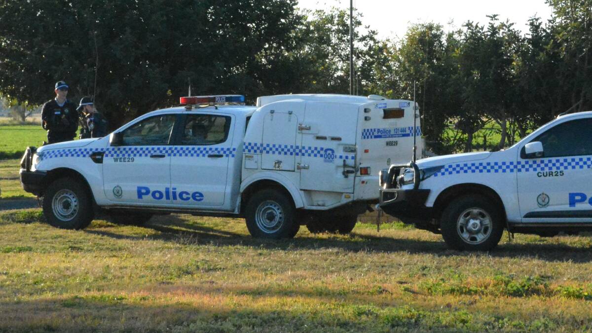 CRIME SCENE: Police at the property on the outskirts of Gunnedah on Wednesday afternoon. Photo: ACM