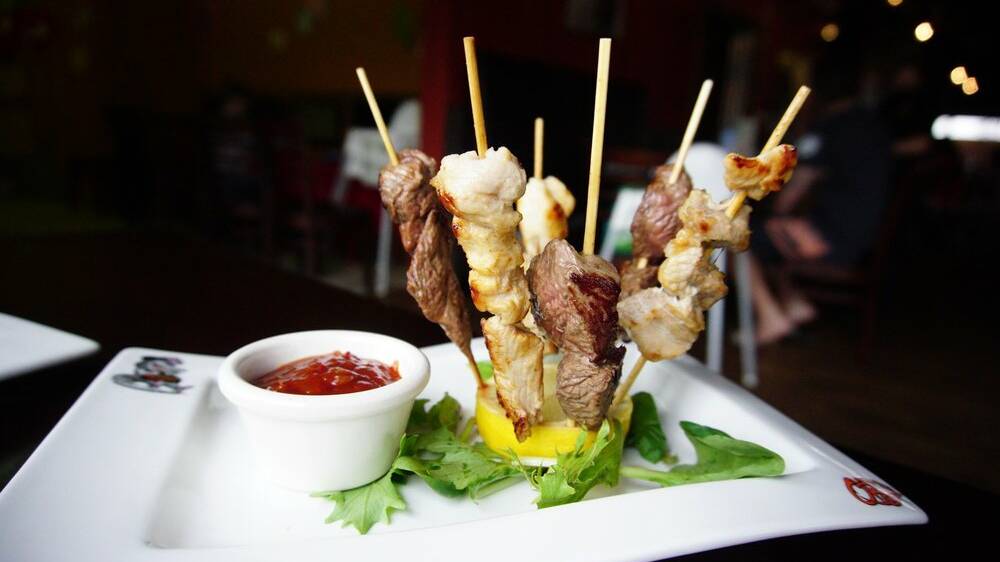 Kangaroo and crocodile skewers are served with bush chutney at Outback Jack's Bar and Grill. 