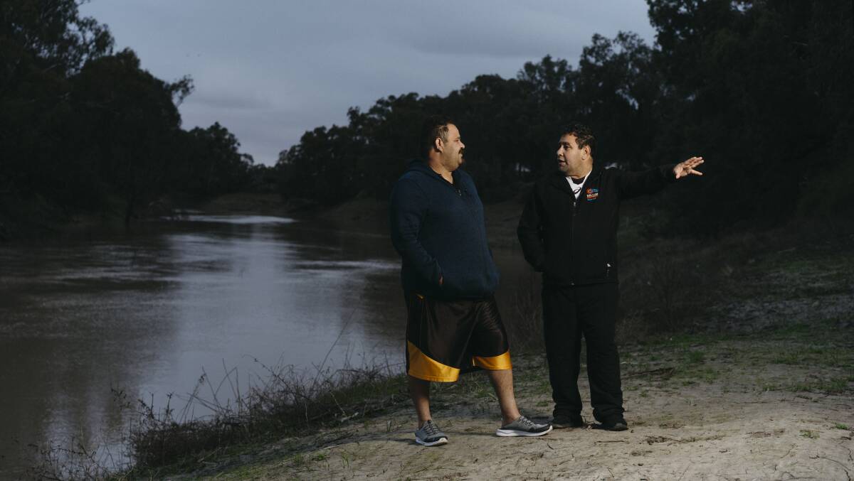Rob Clayton and Brendon Adams on the banks of the Barka/Darling River at Wilcannia. Picture: Dion Georgopoulos.