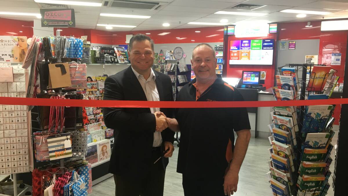 IT'S OFFICIAL: Member for Orange Phil Donato with Orange Central Newsagency's Gary Allen. 