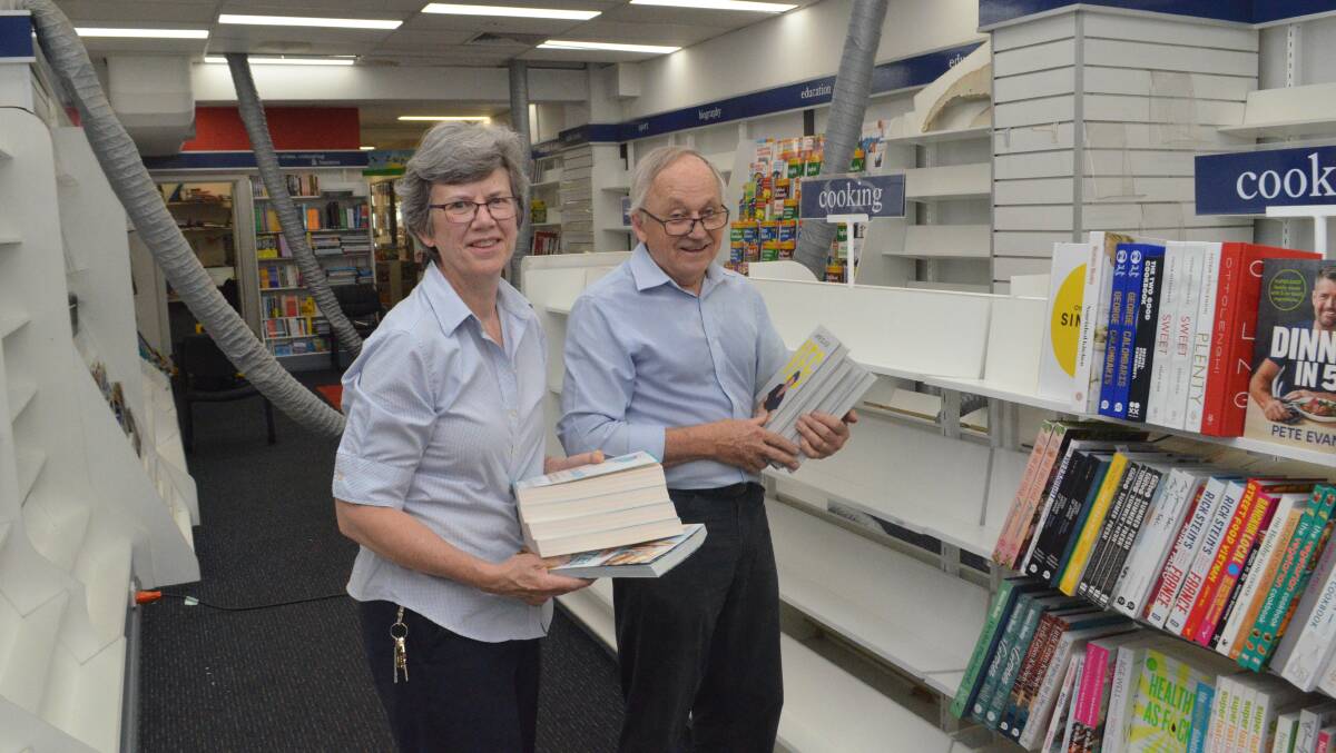 RELIEVED: Margaret and Phillip Schwebel from Collins Booksellers were grateful to two customers who helped them move books when the roof leaked. Photo: DANIELLE CETINSKI