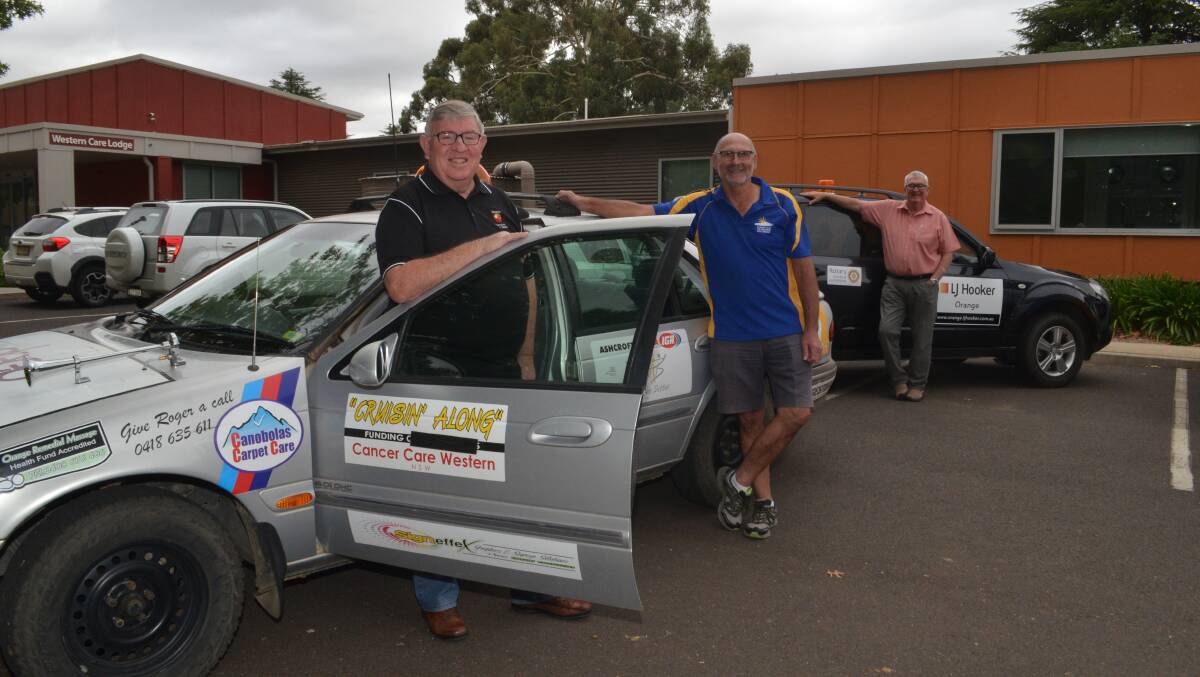 READY TO ROLL: Colin Nayda, Peter Perriman and Ray Fleming with Mr Nayda's modified 1997 Ford Fairmont. Photo: DANIELLE CETINSKI