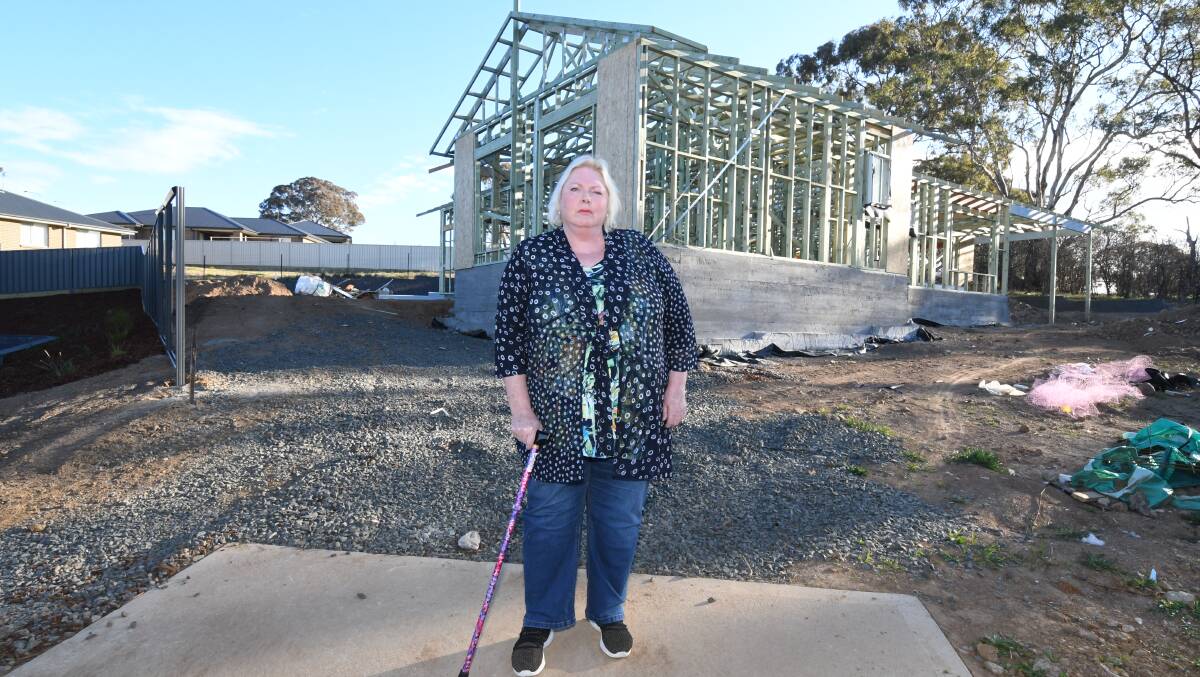 OVERWHELMED: Fiona Bond outside her home under construction. 