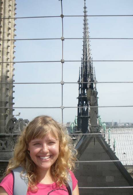 GONE, NOT FORGOTTEN: A much younger Danielle Cetinski in front of the Notre Dame spire in 2011, eight years before it burned down. 