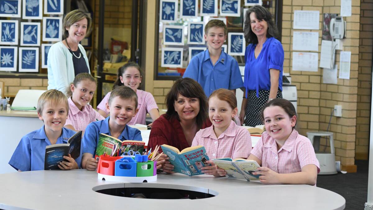 PLEASED WITH SCORES: (Back) St Mary's Catholic Primary School teachers and students Amelie Staniforth, Sally Curran, Mya Simmons, Blake Pawsey and Karen Proudford, (front) Dougald Hook, Patrick Frew, Helen Chegwidden, Grace Kemp and Macey Thomas.