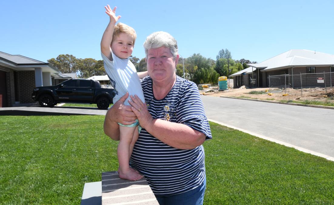 DOWNSIZING: Lyn Cantwell enjoys entertaining two-year-old grandson Callum at her Myrtle Close home. Photo: JUDE KEOGH