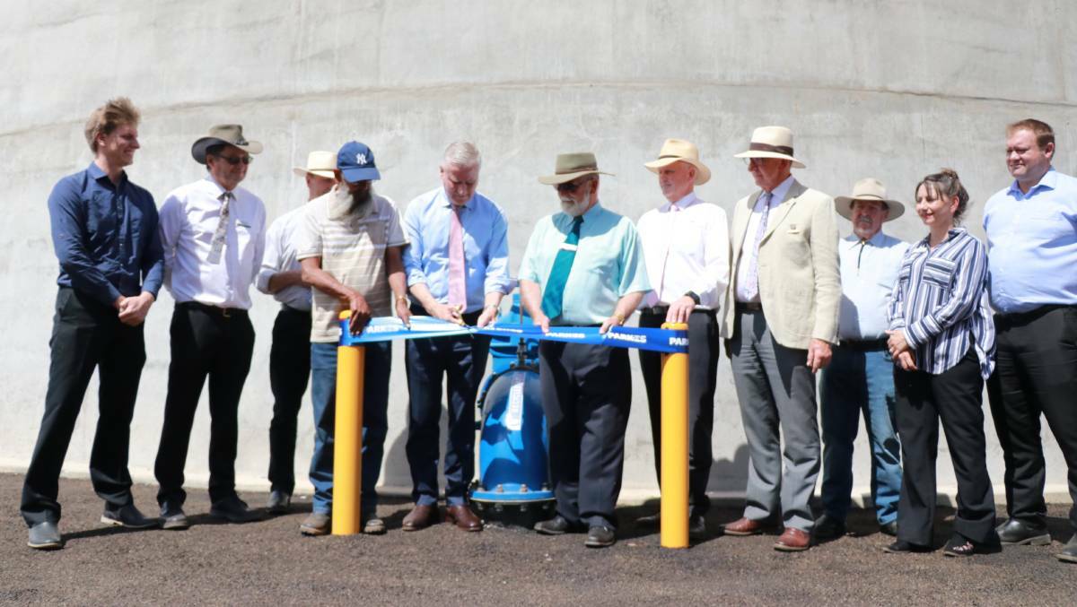 MOMENTOUS DAY: Indigenous elder Robert Clegg, Deputy Prime Minister and Member for Riverina Michael McCormack and Parkes mayor Ken Keith cut the ribbon on the integrated water cycle management system, surrounded by councillors and staff, in October.