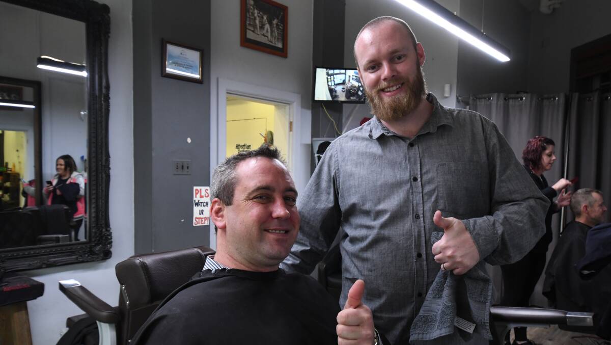 FRESHLY SHAVEN: Westpac Orange branch manager Dom Porter with Mane Man's Barbershop's Pat Hodgson. Photos: JUDE KEOGH