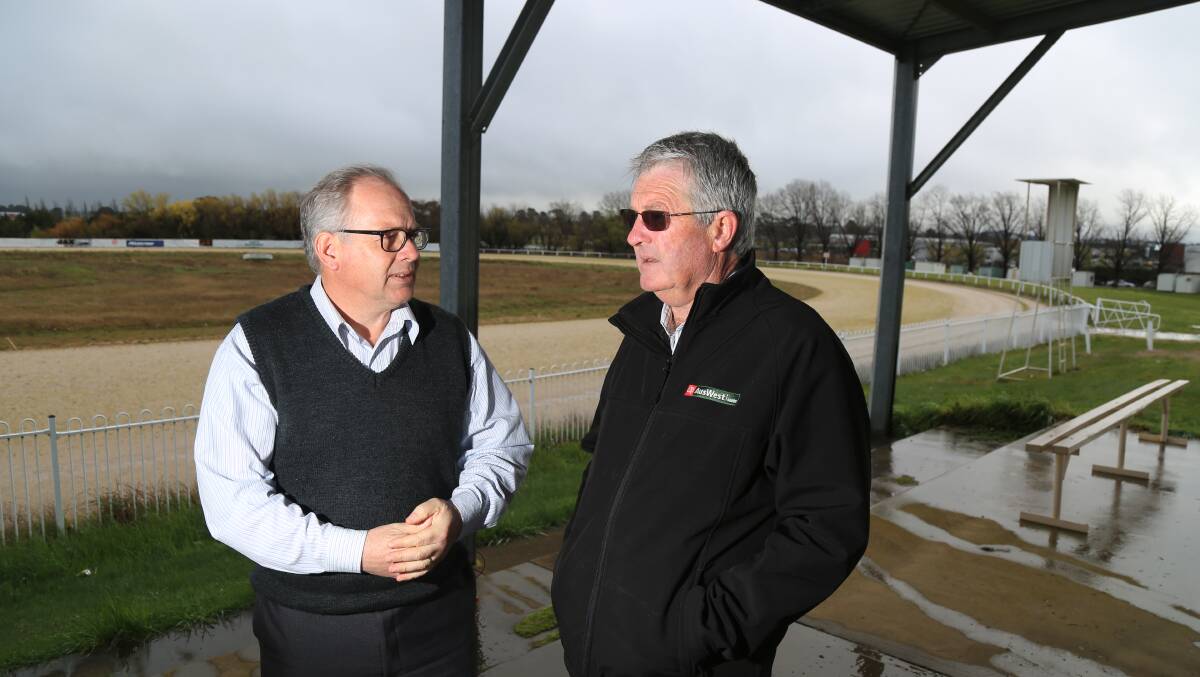 ON THE MARKET: Councillor Jeff Whitton with Orange Harness Racing Club president Frank McRae at the Highlands Paceway. Photo: PHIL BLATCH 0930pbtrack6