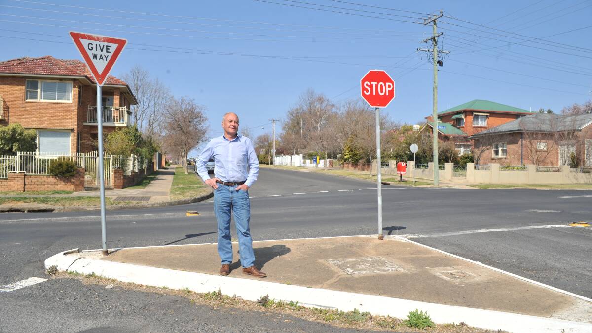 INTERSECTION INTERVENTION: Councillor Russell Turner at the corner of Anson and Warrendine streets where he hopes a roundabout can be built. Photo: JUDE KEOGH 0921jkround1