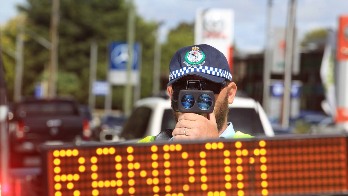 ON GUARD: Senior Constable Bart Czyzcwski conducts breath-testing and speed-checking on the Escort Way. Photo: PHIL BLATCH