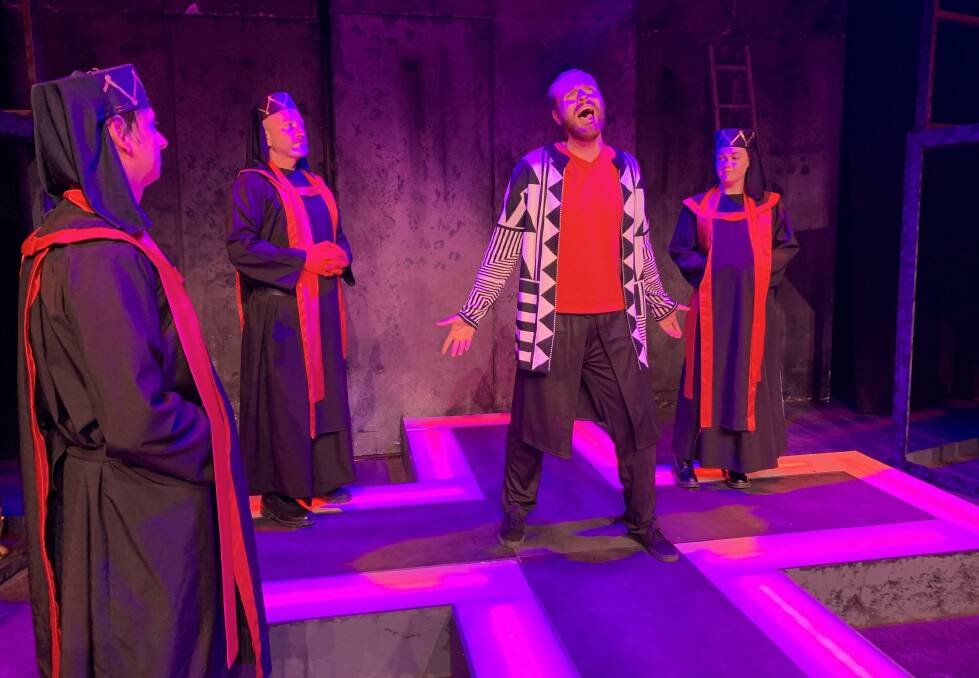 TORN: Alan Moxey as Judas with priests Tim Hewitt, Alex Kovic and Erinn Rimmer. Photo: DANIELLE CETINSKI