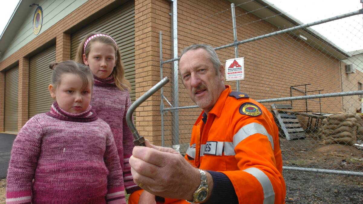FLASHBACK: Orange SES controller Kim Stevens in 2005 with granddaughters Jessica and Nicole Smith. Photo: STEVE GOSCH