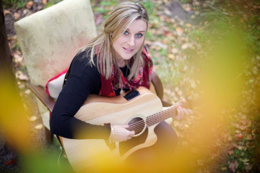 FLORIST TURNED TEACHER: Megan Woods will teach guitar full-time this year. 