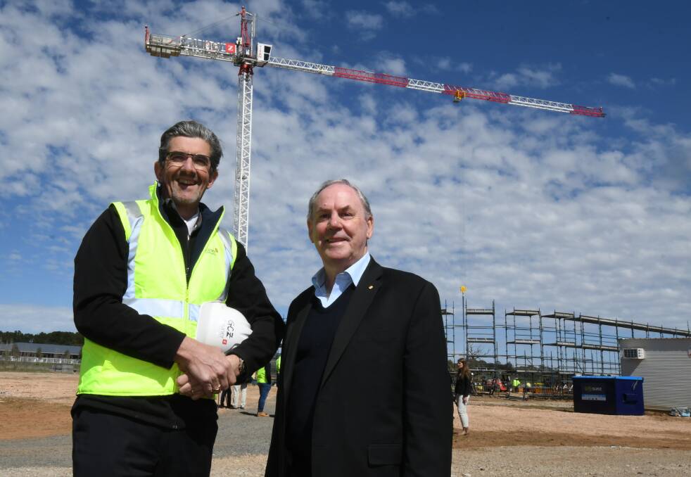 HEADING SKYWARDS: Zauner Construction Group chief executive officer Garry Zauner and James Richmark director Frank O’Halloran at the Bloomfield Medical Centre. Photo: JUDE KEOGH 0919jkprivate1