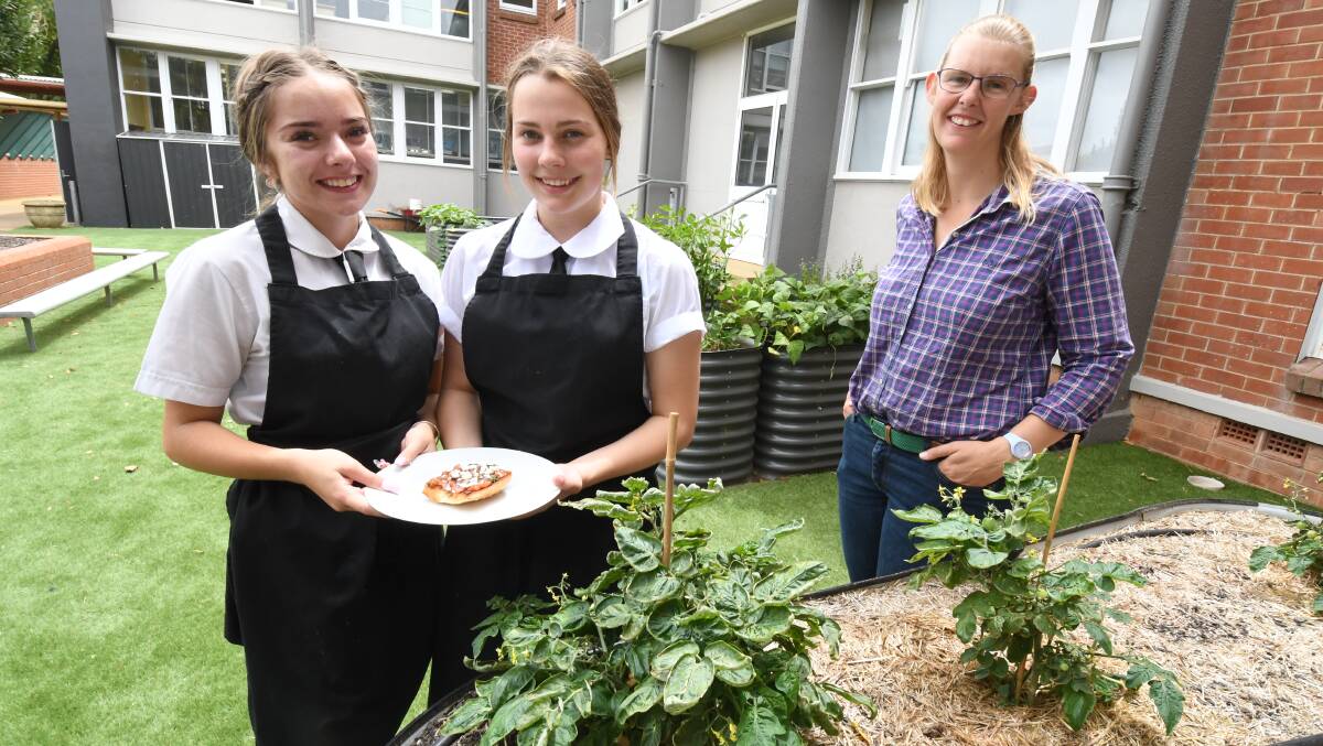 TASTY: Orange High School students Ginger Wotters-Wood and Elouisa Monaghan with agriculture teacher Mel Campbell. Photo: JUDE KEOGH
