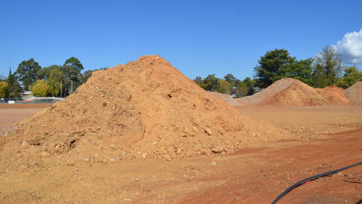 PILED UP: The dirt piles on the former hospital site, from Dalton Street. Photo: DANIELLE CETINSKI