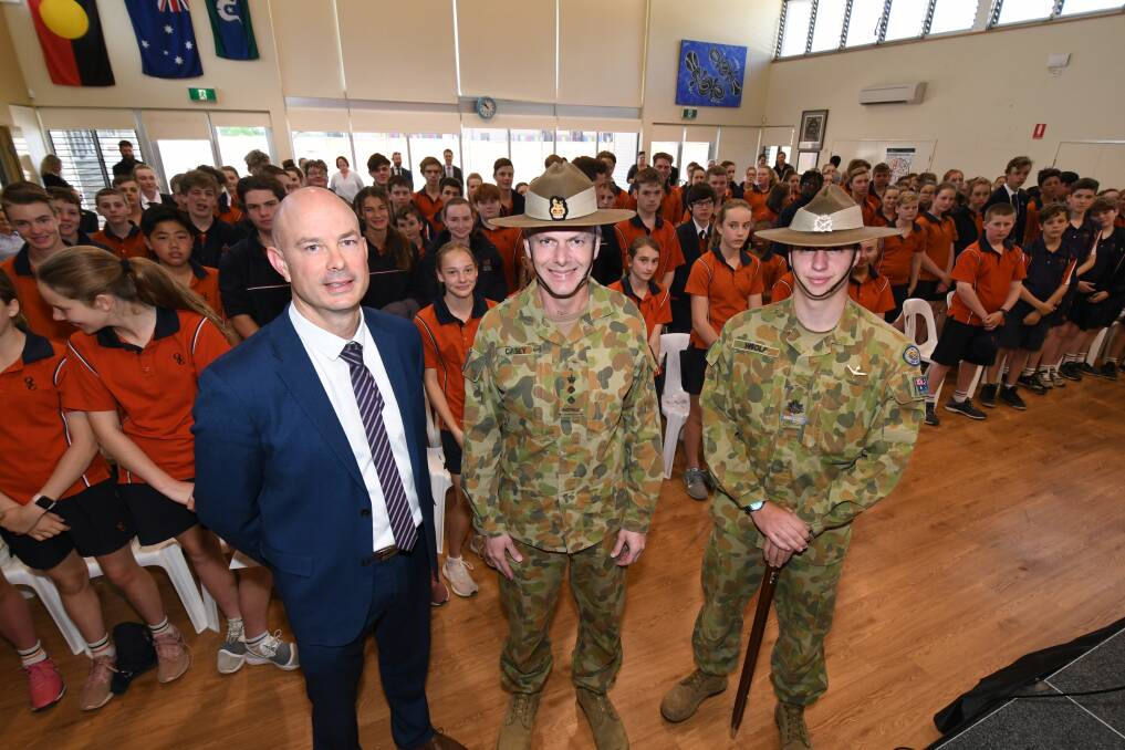 FALL IN: Orange Anglican Grammar School principal Louis Stringer, Colonel Brendan Casey and army cadet First Officer Ben Woolf launched the 252ACU. Photo: JUDE KEOGH