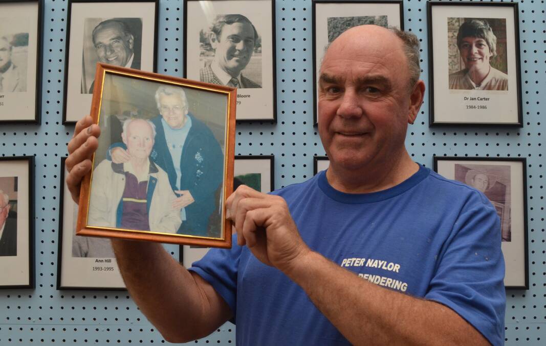 PROUD SON: Orange Show Society president Peter Naylor with a picture of his parents, the late Ray and Betty Naylor. Photo: DANIELLE CETINSKI 0419dcnaylor1