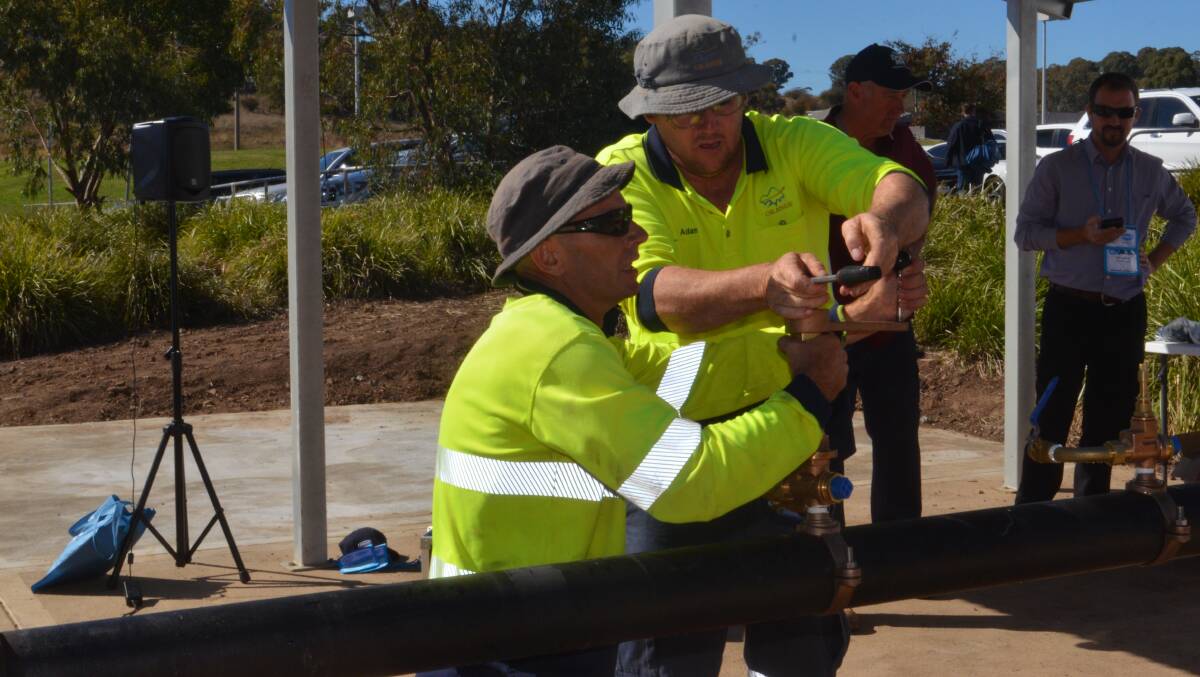 ALL IN DAY'S WORK: Orange City Council water crew members Daniel Eassie and Adam Whitely beat the competition. Photo: DANIELLE CETINSKI