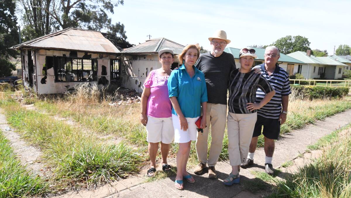 PATIENCE THIN: Glenroi residents Christine Gaviegan, Sue Duchnaj, Bernard and Katy Sharah and Kevin Carr are concerned about the condition of this home. Photo: JUDE KEOGH 