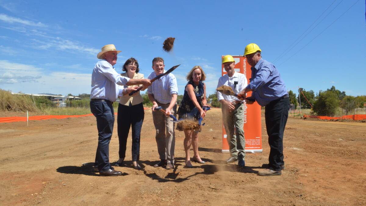 KICKING IT OFF: Former Western NSW parlimentary secretary Rick Colless and Nationals candidate for Orange Kate Hazelton, member for Calare Andrew Gee, Haslin Constructions general manager Gladys Woods, councillor Scott Munro and deputy mayor Sam Romano turned the first sod in March. Photo: DANIELLE CETINSKI