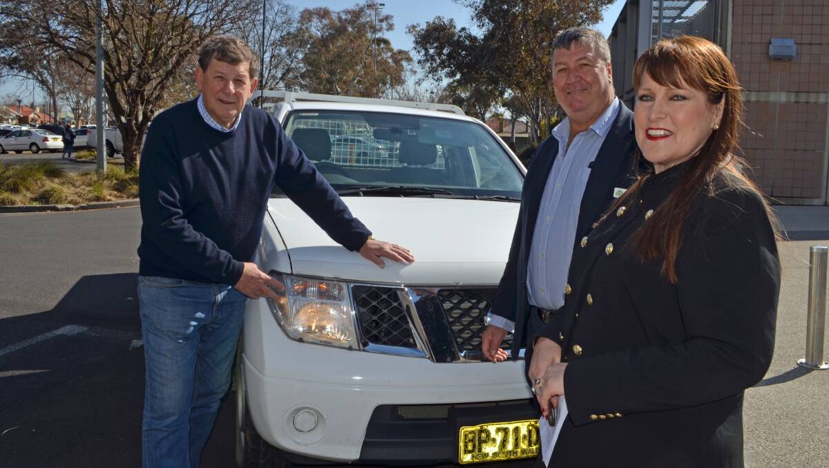 LET THERE BE LIGHT: Orange mayor Reg Kidd, Cabonne mayor Kevin Beatty and Orange-Cabonne road safety officer Andrea Hamilton-Vaughan. Photo: SUPPLIED