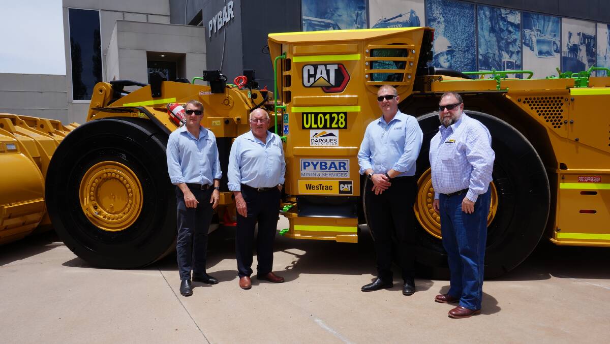 BIG CAT: Pybar CEO Brendan Rouse, executive chairman Paul Rouse, chief technical officer Andrew Rouse and WesTrac mining business manager Neil Roberts with a newly-arrived Cat R1700 underground loader. The loader's automation capabilities have been tested for two years. 