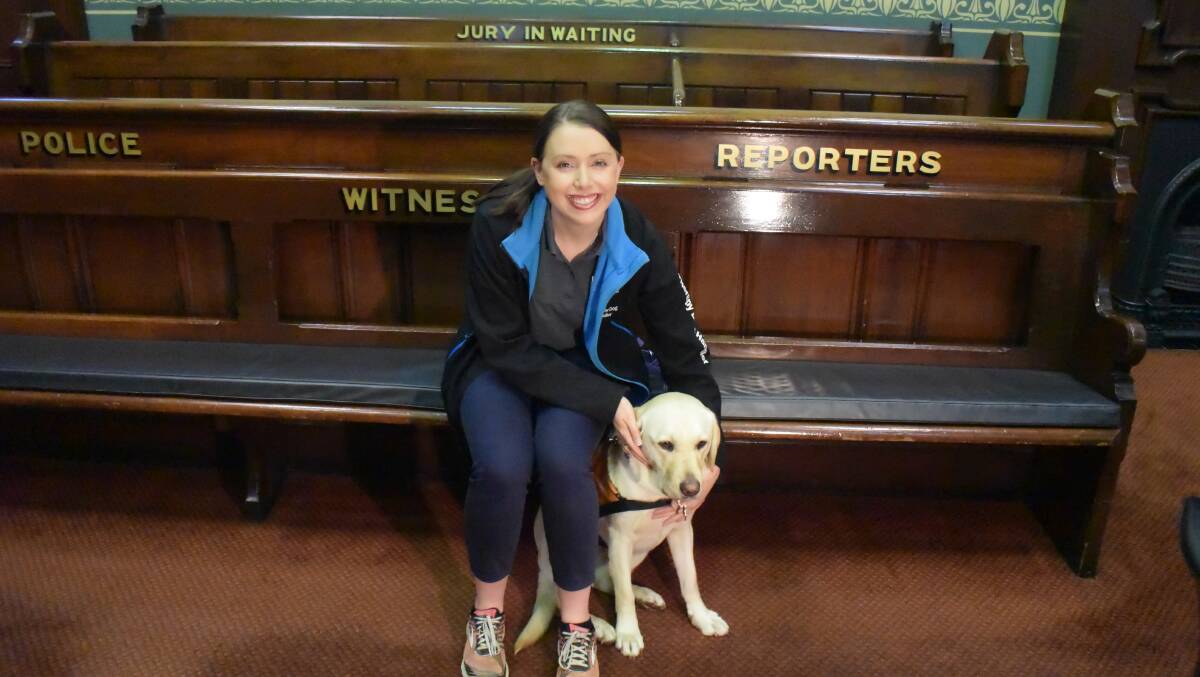 MOOD CHANGE: Ollie the labrador with Guide Dogs NSW/ACT handler Samantha McGill inside Orange Courthouse. Photo: DANIELLE CETINSKI