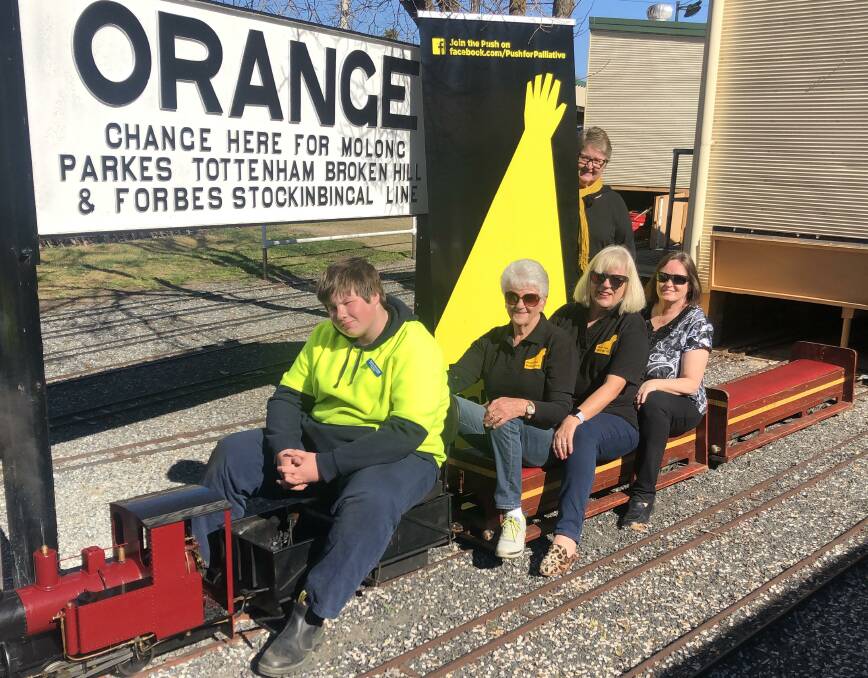 ON TRACK: Orange Society of Model Engineers' Evan Kennedy with Orange Push for Palliative's Clair Thompson, Gail Pringle, Jenny Hazelton and Leanne Boss. Photo: SUPPLIED