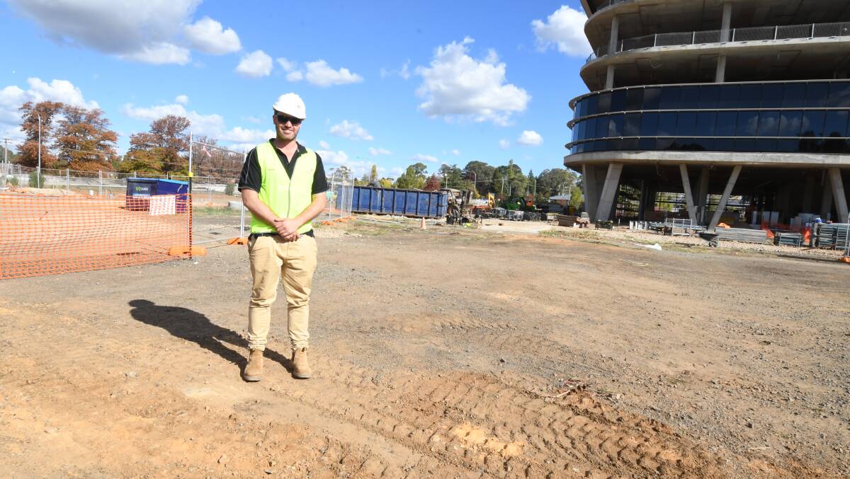 NEXT STEP: Zauner Construction Group site manager Nick Windsor on the site proposed for retail, beside Bloomfield Medical Centre. Photo: JUDE KEOGH 0417jksupermarket3