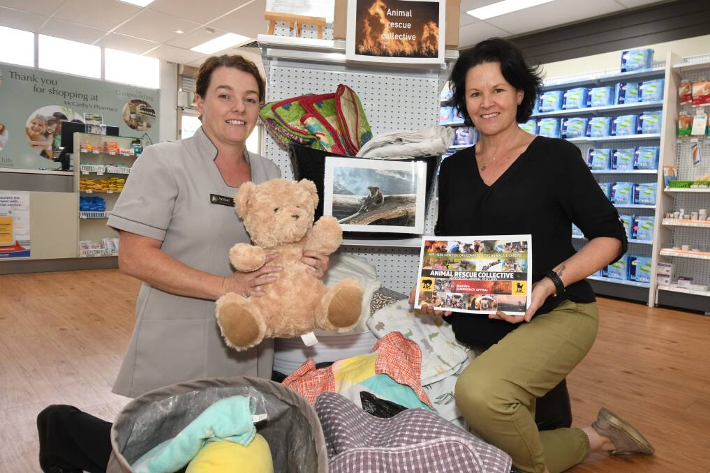 ANIMAL AID: McCarthy's Pharmacy's Amber Carr and Animal Rescue Collective's Milissa Lennon with donations. Photo: CARLA FREEDMAN