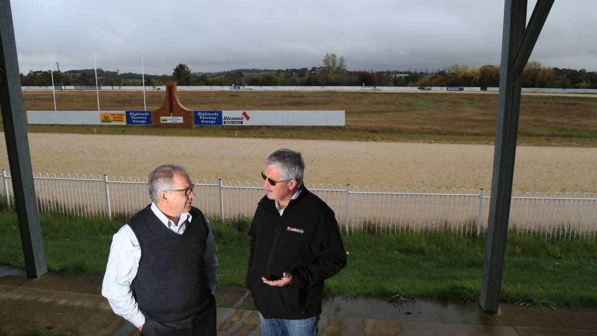 GOING, GONE: Councillor Jeff Whitton with Orange Harness Racing Club president Frank McRae at the Highlands Paceway. Photo: PHIL BLATCH 0930pbtrack3