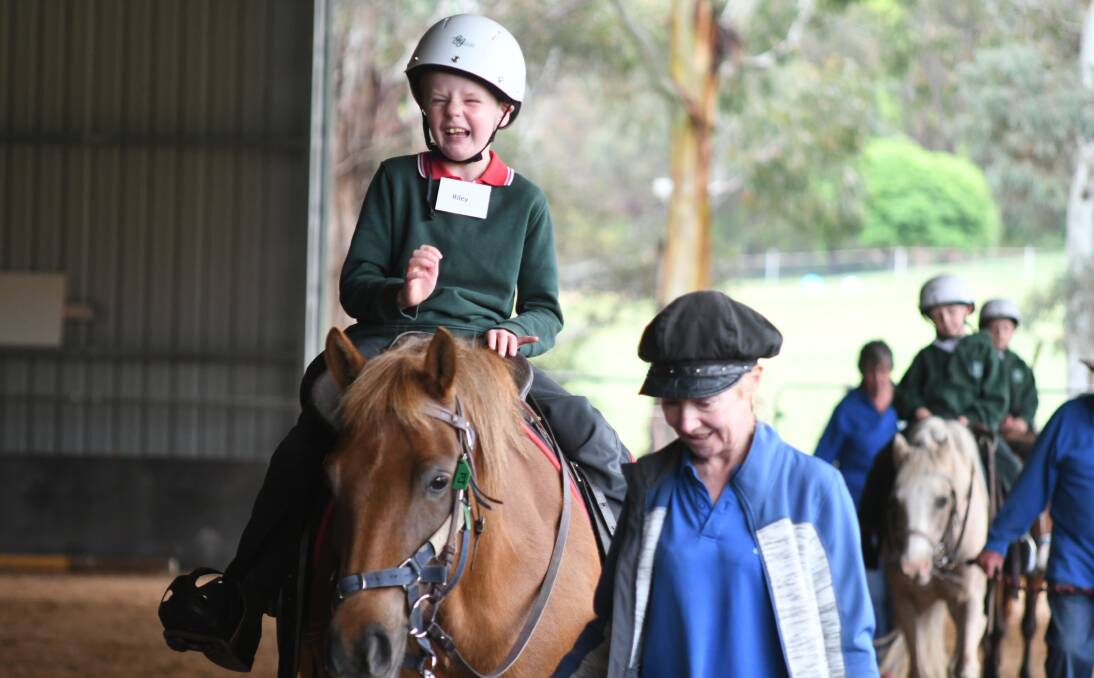 MORE LAUGHS: Riley Gilbert rides a pony at Riding for the Disabled, which received a grant. Photo: JUDE KEOGH
