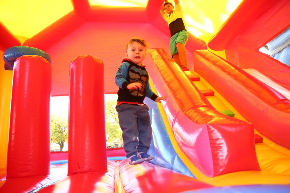 HAVING A BALL: Hudson Burns prefered the jumping castle at Moulder Park to the market stalls. Photo: PHIL BLATCH 0507pbrotary2
