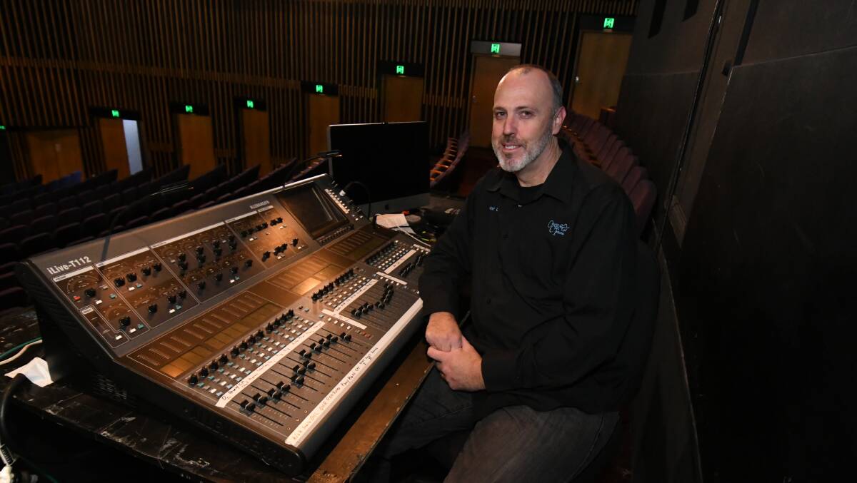 AT THE DESK: Peter Campbell has worked at Orange Civic Theatre for 23 years. Photo: JUDE KEOGH 0516jklovework1
