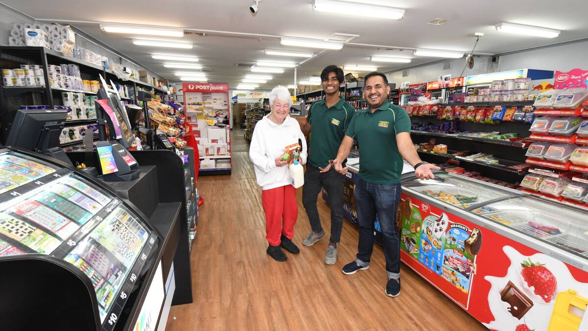 FRESH LOOK: Jack's Friendly Grocer customer with Wendy Fisher, staff member Nash Paswan, and co-owner Mani Singh. Photo: JUDE KEOGH 0412jkgrocer1