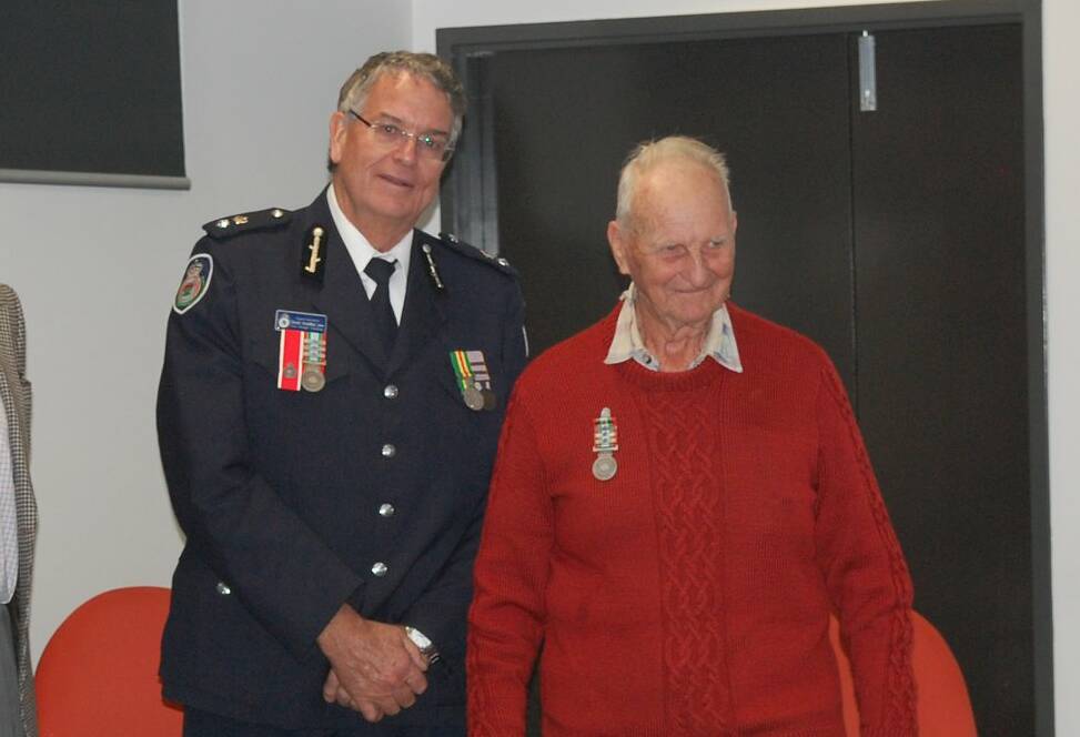 Canobolas Zone manager Superintendent David Hoadley with Uel Balcomb and his medal for 68 years' service.