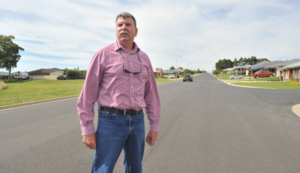 RACE TRACK: Councillor Glenn Taylor on William Maker Drive, near Glasson Drive. He believes traffic-calming measures are essential to curb high speeds. Photo: JUDE KEOGH